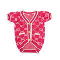Cardigan con monogramma GG e rose, con bottoni dorati.